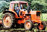 An photo of a tractor working the fields