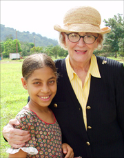 An photo of Alice Shultz with a child from the Las Palmas Children's Village