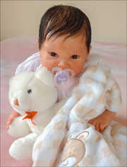 photo of a life-like infant doll