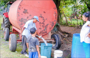 A photo of the Fuente de Vida water being distributed from the mobile water tank