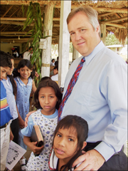A photo of Rick Fleck in Guatemala with a group of kids from Los Pinos