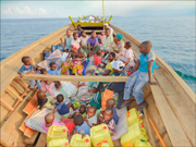 Photo of ICC Congo children being transported by boat to the Patmos Children's Village